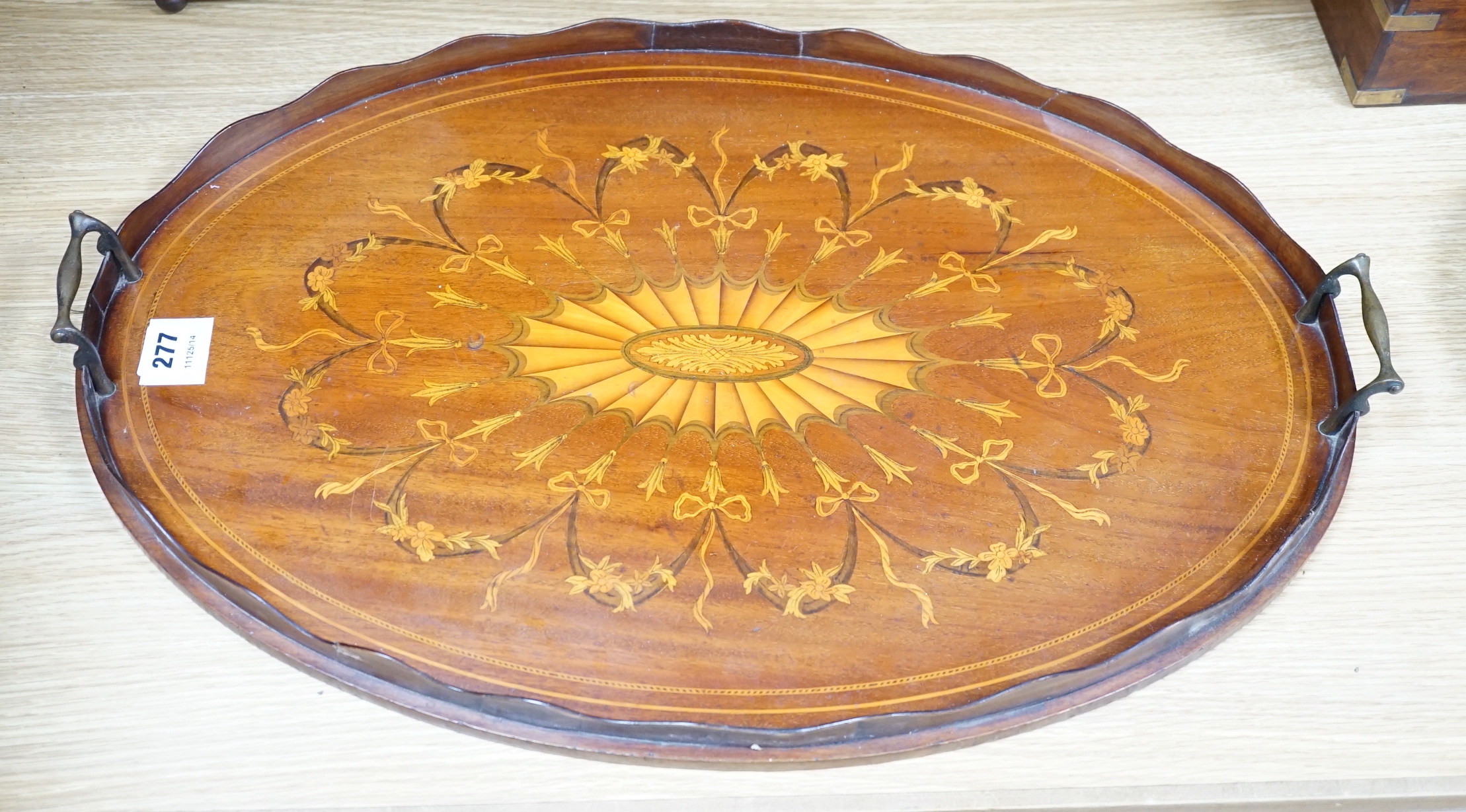 An Edwardian marquetry inlaid oval mahogany two handled tea tray, 63cm